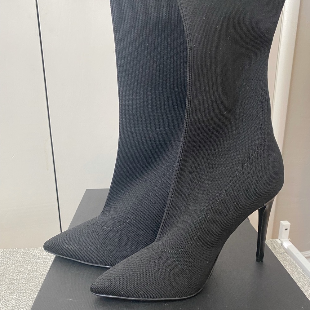 Thigh high heeled black boots